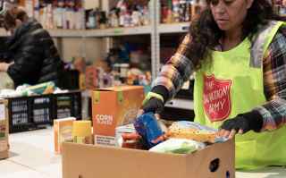 Salvation Army volunteer sorting food donations